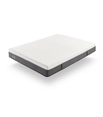 Vista detallada del colchón Magnum sobre una base de cama, mostrando su diseño acolchado y superficie ergonómica, ideal para ofrecer un descanso óptimo y soporte lumbar.