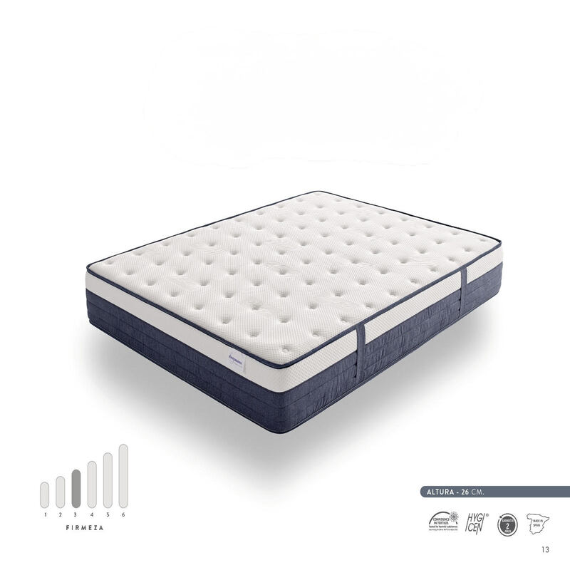 Colchón Prisma de diseño elegante sobre base de cama en dormitorio moderno, destacando sus capas y tejido premium para un descanso óptimo