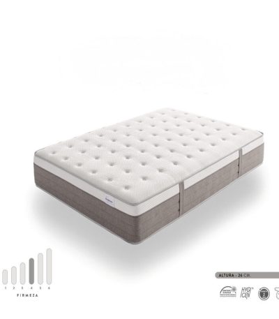 Colchón Hybrid Premium con diseño de doble capa, que combina espuma viscoelástica y muelles ensacados para mayor confort. Imagen del colchón sobre base tapizada, en dormitorio moderno y luminoso.